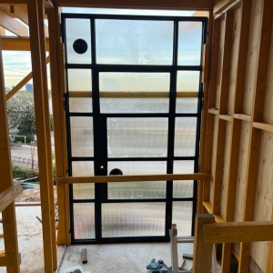 Home Elegant Wrought Iron Double Entry Door with Arched Top and Decorative Scrollwork